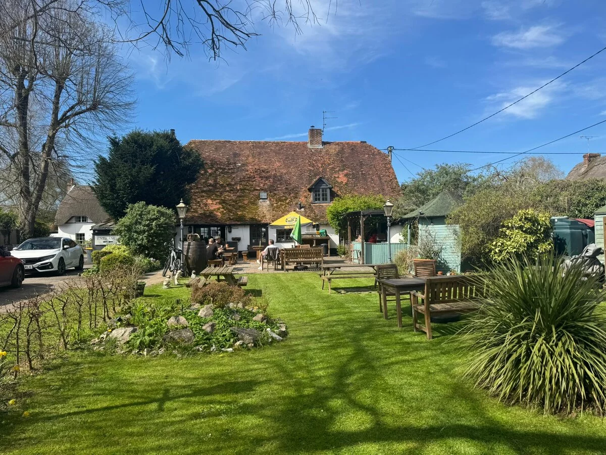 The Cricketers Inn from the garden on a sunny day