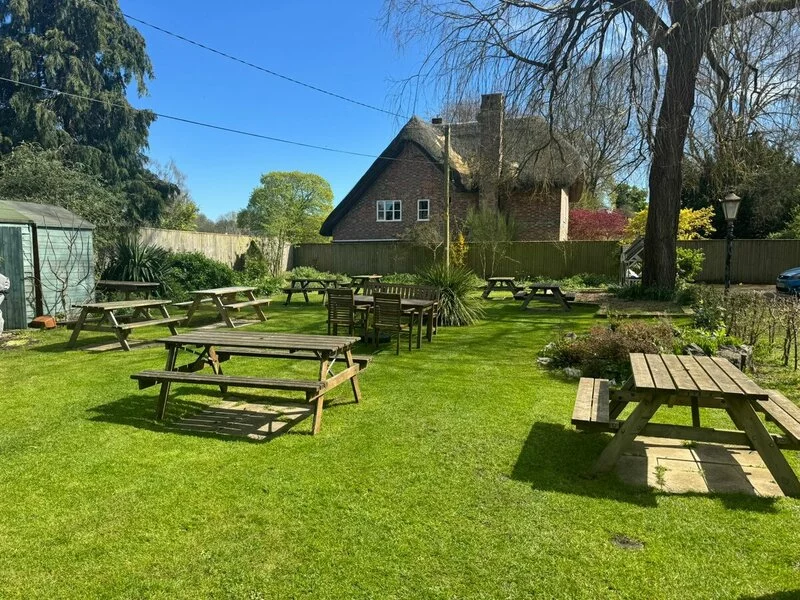 The garden and outdoor dining space at The Cricketers Inn