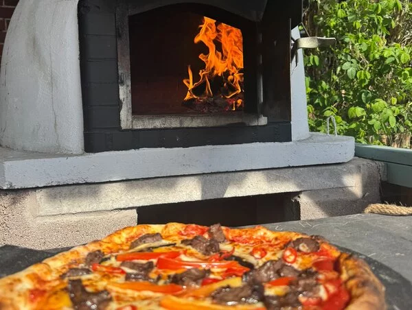 Freshly baked pizza from our wood-fired oven
